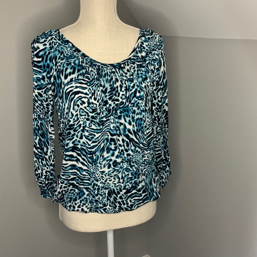 Woman’s blouse, white, blue, and black color, used.